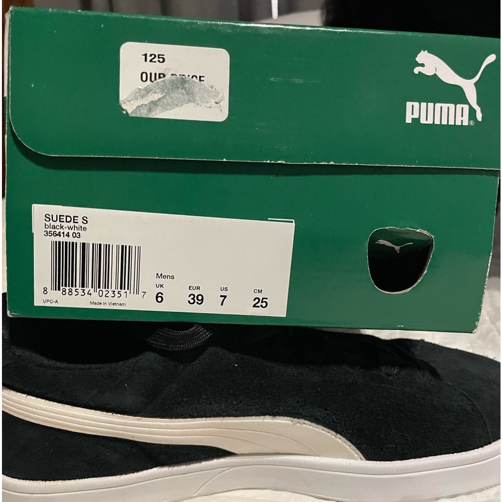 Brand new black suede Puma.